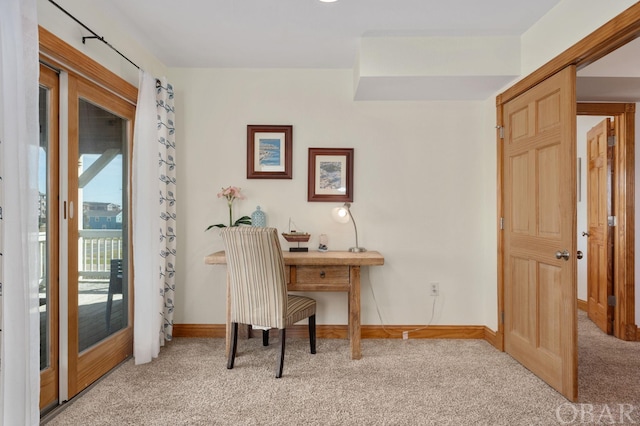 office area featuring carpet flooring and baseboards