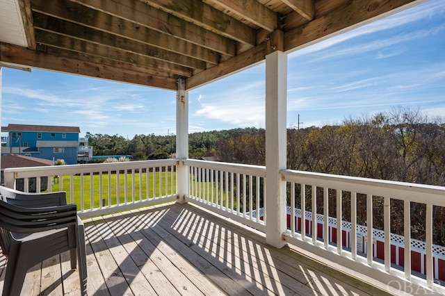 wooden deck with a yard