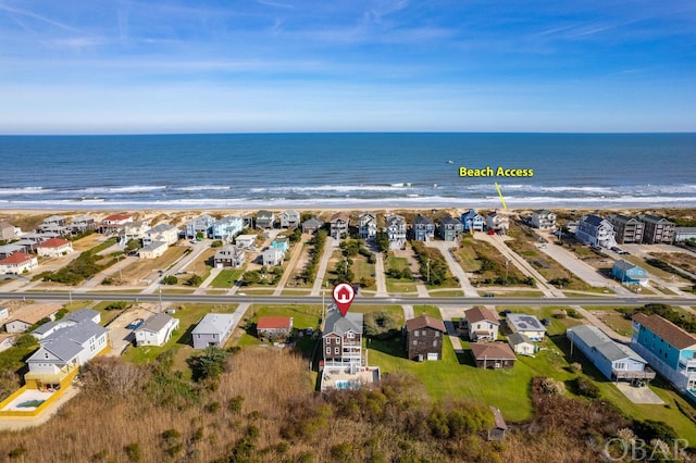 aerial view featuring a residential view and a water view