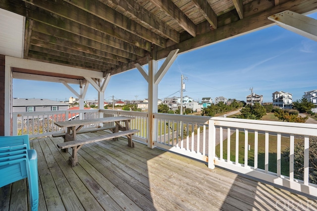 wooden deck with a yard