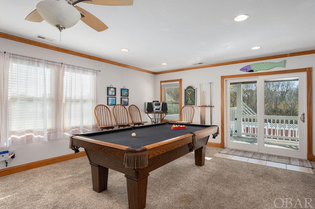 rec room with baseboards, ornamental molding, and light colored carpet