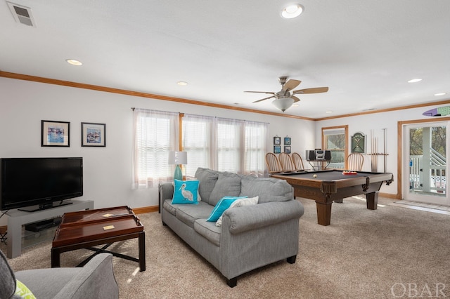 living area featuring ornamental molding, visible vents, light carpet, and baseboards