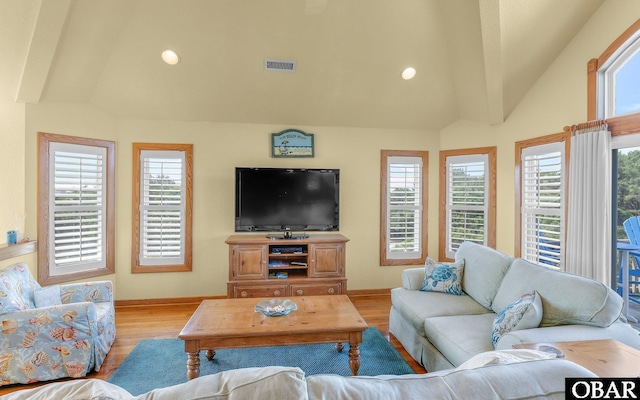 2132 Dolphin Ln Lot 62, Corolla, NC 27927 - living room featuring light wood-type flooring, vaulted ceiling, healthy amount of natural light, and recessed lighting