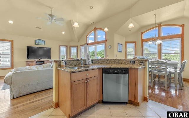 2132 Dolphin Ln Lot 62, Corolla, NC 27927 - kitchen with stainless steel dishwasher, lofted ceiling, open floor plan, light stone countertops, and a ceiling fan