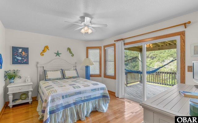 2132 Dolphin Ln Lot 62, Corolla, NC 27927 - bedroom featuring access to outside, light wood finished floors, multiple windows, and a ceiling fan
