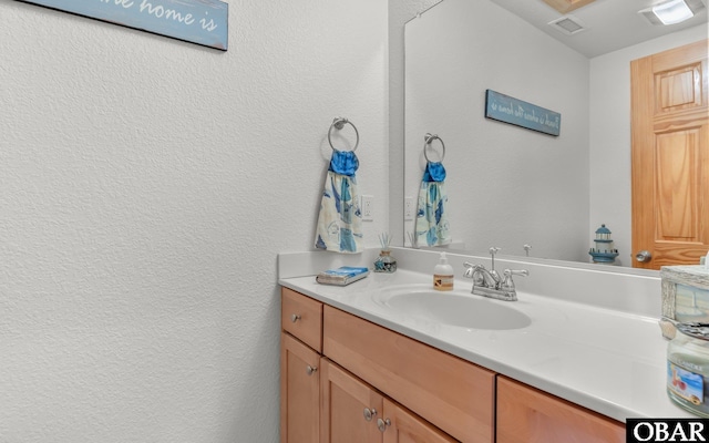 2132 Dolphin Ln Lot 62, Corolla, NC 27927 - bathroom with a textured wall and vanity