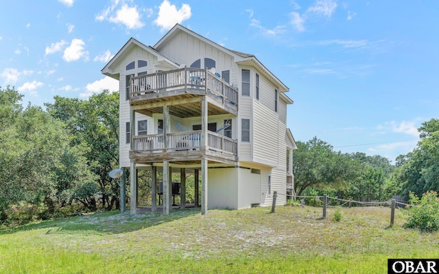 2132 Dolphin Ln Lot 62, Corolla, NC 27927 - rear view of property with board and batten siding and a wooden deck