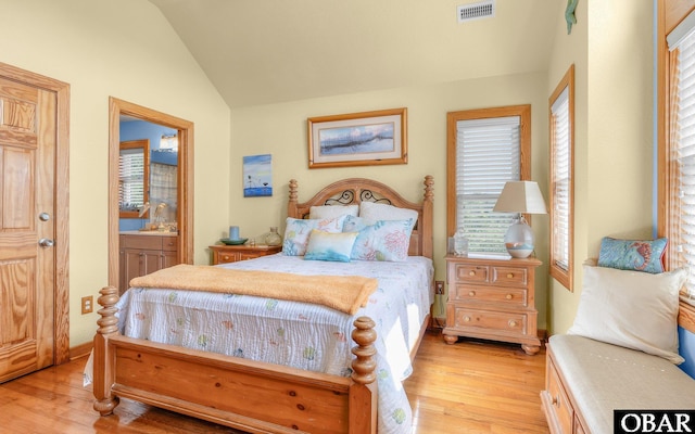 2132 Dolphin Ln Lot 62, Corolla, NC 27927 - bedroom featuring lofted ceiling, light wood-type flooring, and ensuite bathroom
