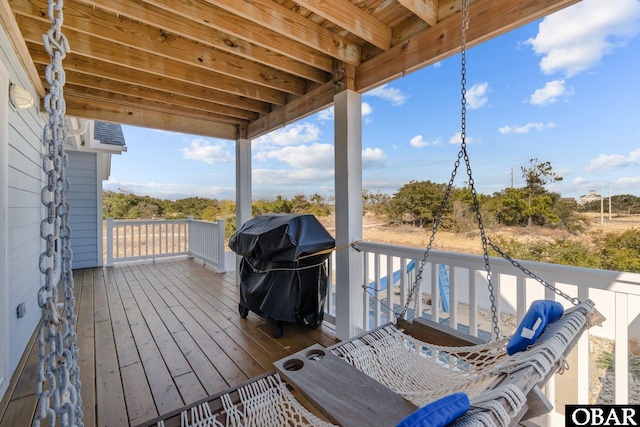 wooden terrace featuring area for grilling