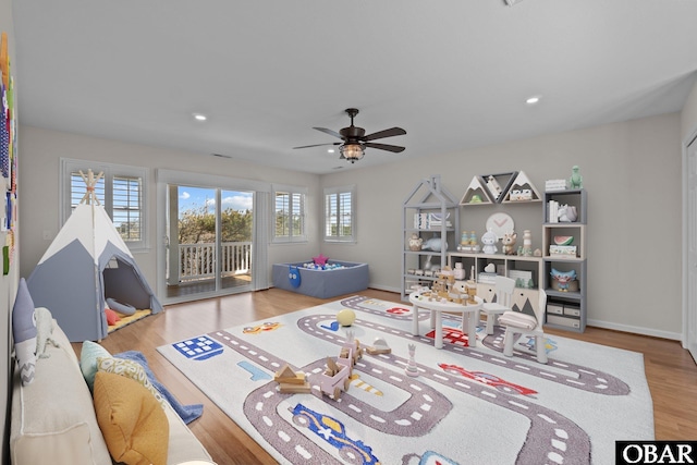 interior space featuring recessed lighting, baseboards, wood finished floors, and a ceiling fan