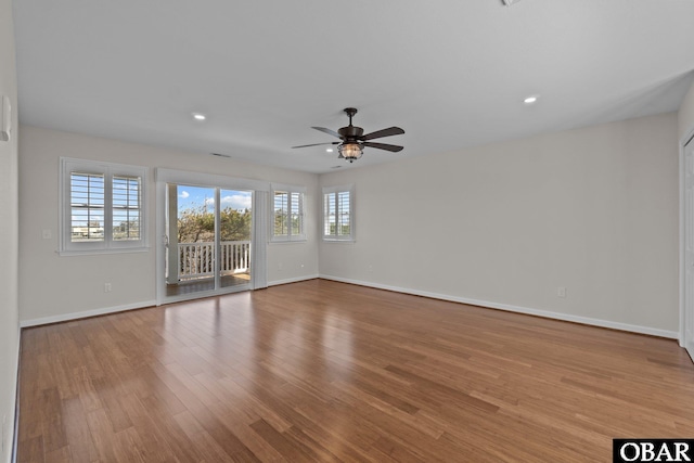 spare room featuring recessed lighting, wood finished floors, baseboards, and ceiling fan