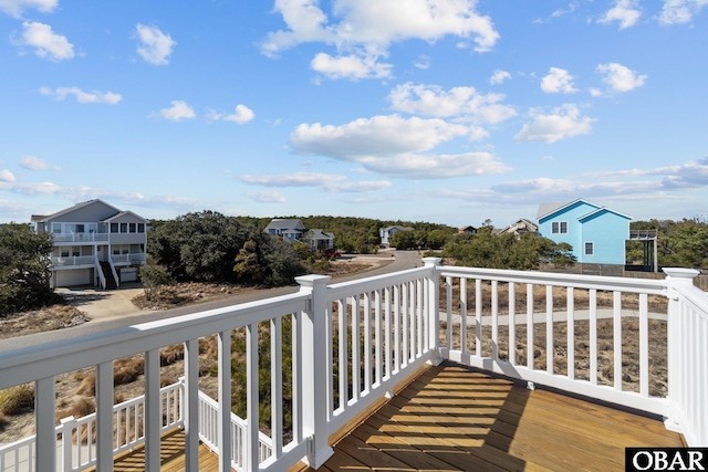 wooden terrace featuring a residential view