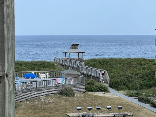 property view of water featuring stairway