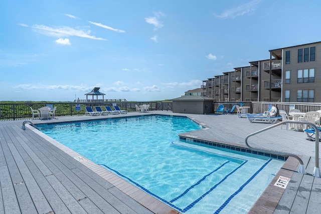 community pool featuring fence