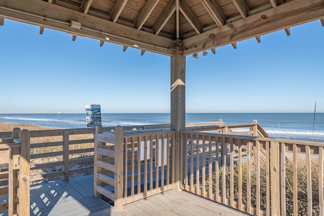 view of property's community featuring a water view and a view of the beach