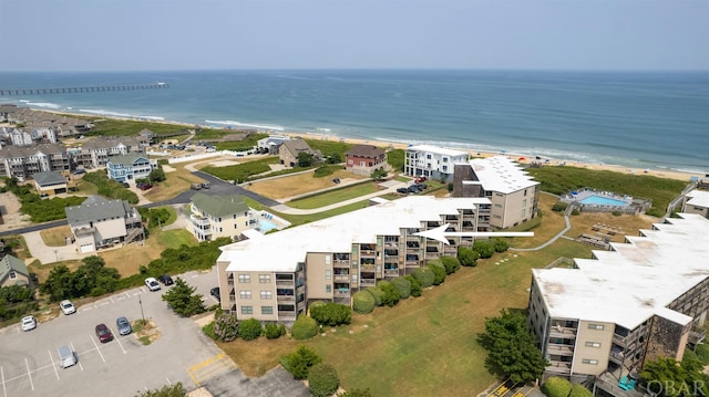 drone / aerial view featuring a view of the beach and a water view