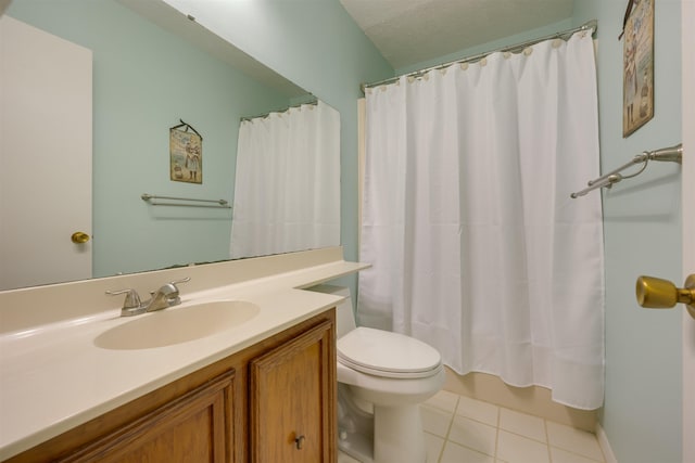 bathroom featuring shower / bath combo with shower curtain, toilet, a textured ceiling, tile patterned flooring, and vanity