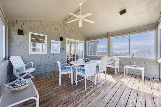 sunroom / solarium featuring vaulted ceiling and a ceiling fan