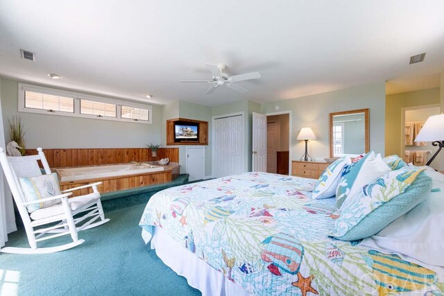 bedroom with a ceiling fan, a closet, visible vents, and carpet flooring