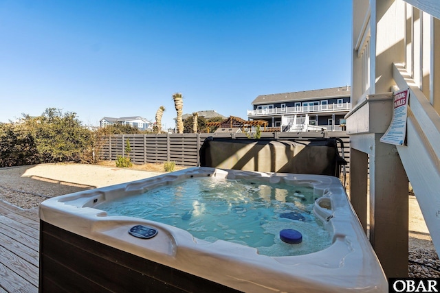 exterior space with a hot tub