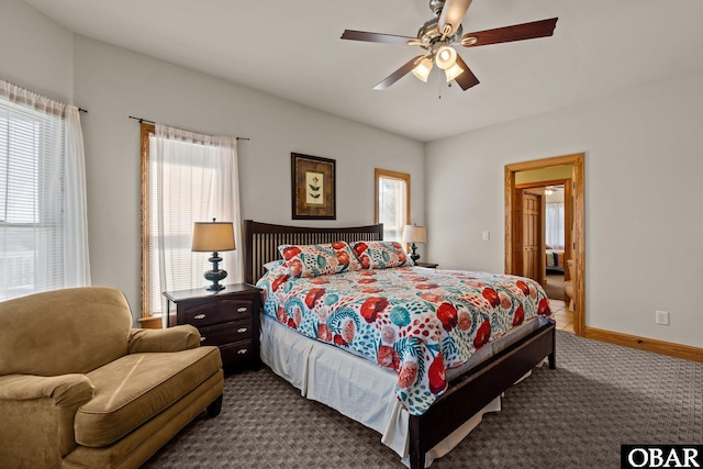 carpeted bedroom featuring ceiling fan and baseboards