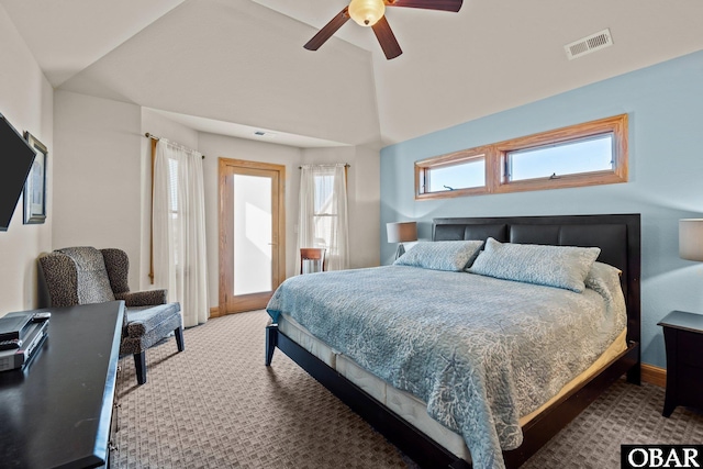 bedroom with ceiling fan, visible vents, vaulted ceiling, and light colored carpet