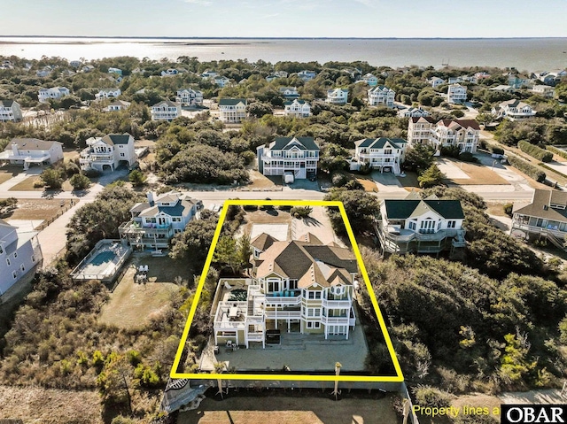 aerial view featuring a water view and a residential view