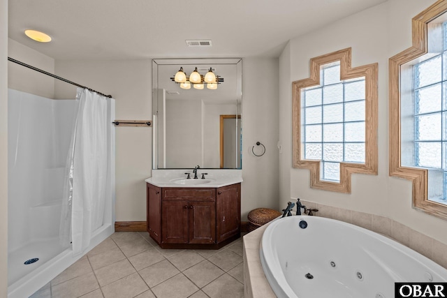 bathroom featuring a stall shower, tile patterned flooring, a jetted tub, and visible vents