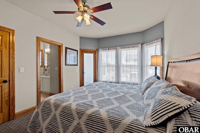 bedroom with a ceiling fan, baseboards, connected bathroom, and carpet flooring