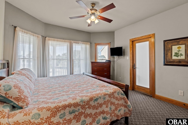 carpeted bedroom with baseboards and a ceiling fan