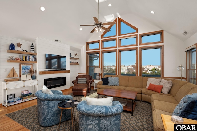 103 Halyard Ct Lot 49, Duck, NC 27949 - living area featuring a large fireplace, wood finished floors, a ceiling fan, recessed lighting, and high vaulted ceiling
