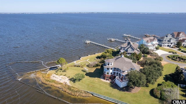 drone / aerial view featuring a residential view and a water view