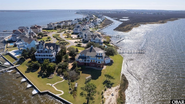 bird's eye view with a water view and a residential view