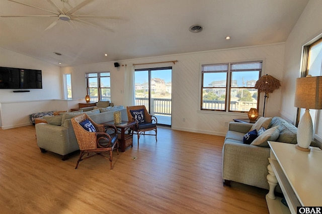 living area with light wood finished floors, baseboards, visible vents, lofted ceiling, and recessed lighting