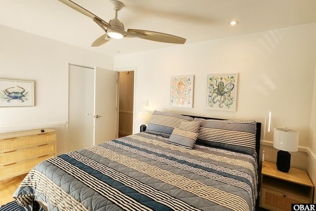 bedroom featuring ceiling fan, wood finished floors, and recessed lighting