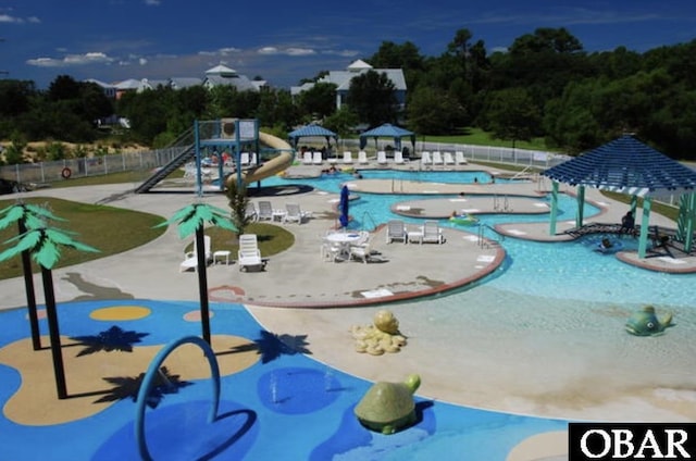 1108 Cambridge Rd Unit 307-I, Kill Devil Hills, NC 27948 - community pool with a water slide and a patio