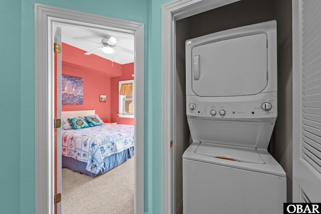 1108 Cambridge Rd Unit 307-I, Kill Devil Hills, NC 27948 - laundry room with stacked washer / drying machine, ceiling fan, and carpet floors