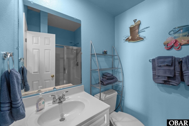 1108 Cambridge Rd Unit 307-I, Kill Devil Hills, NC 27948 - bathroom featuring a stall shower, vanity, and a textured wall