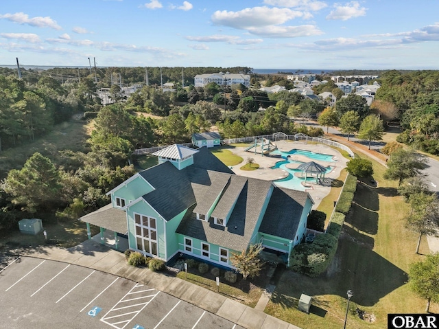 1108 Cambridge Rd Unit 307-I, Kill Devil Hills, NC 27948 - drone / aerial view of a pool area and a tree filled landscape