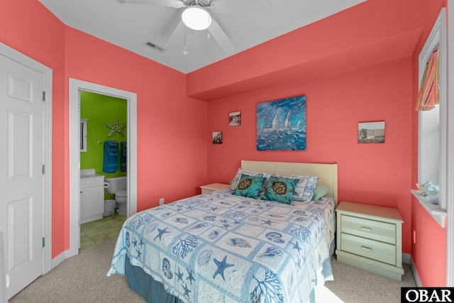 1108 Cambridge Rd Unit 307-I, Kill Devil Hills, NC 27948 - bedroom with carpet flooring, connected bathroom, and a ceiling fan