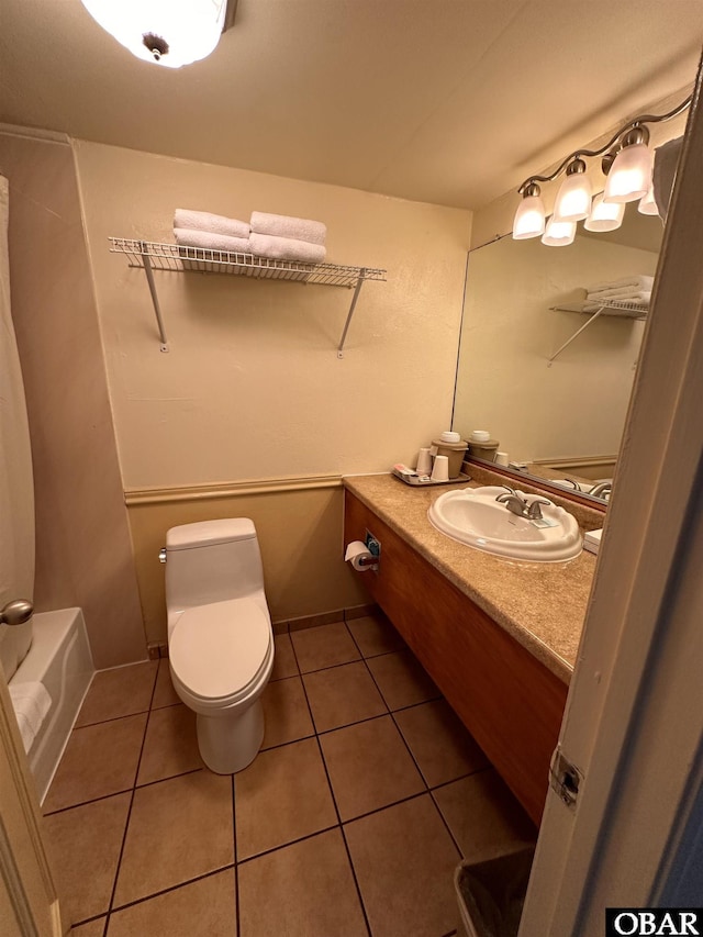 180 Irvin Garrish Hwy Unit 307/308, Ocracoke, NC 27960 - bathroom with vanity, tile patterned floors, and toilet
