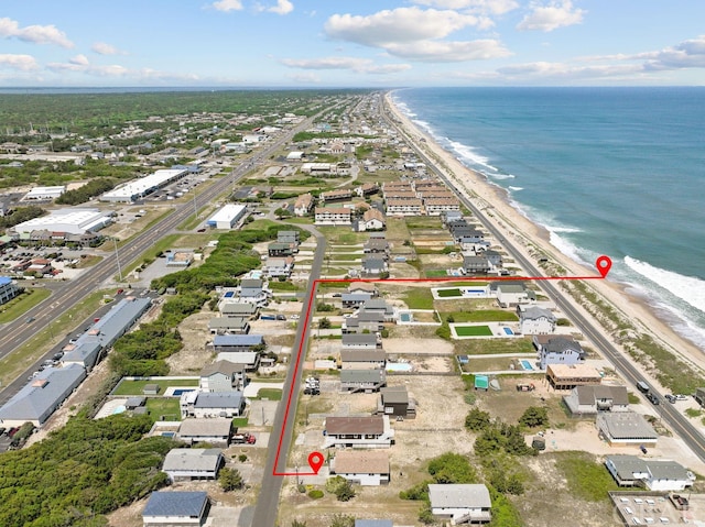 aerial view featuring a view of the beach and a water view