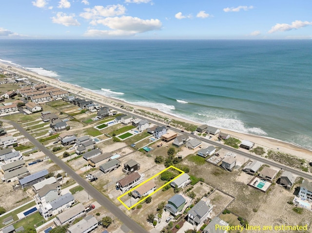 bird's eye view with a beach view, a residential view, and a water view