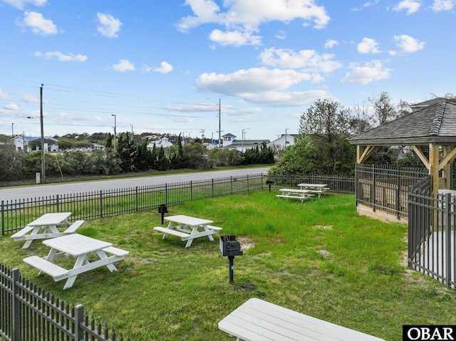 view of yard with fence and a gazebo