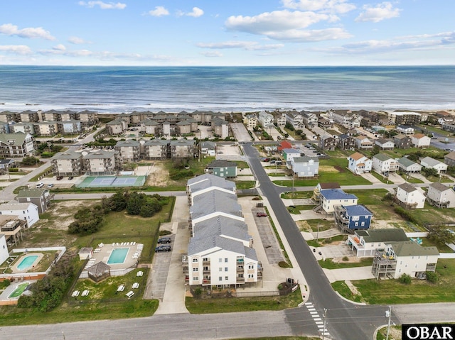 drone / aerial view with a water view and a residential view