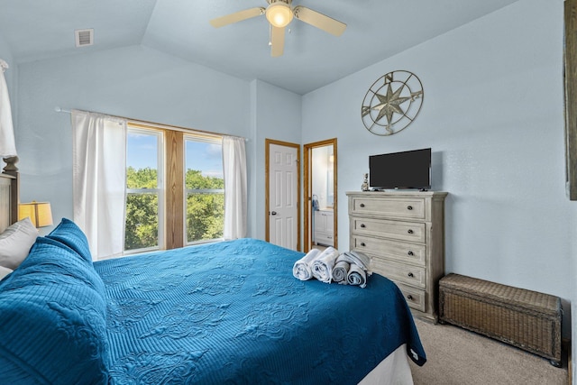 bedroom with lofted ceiling, a ceiling fan, visible vents, and light colored carpet