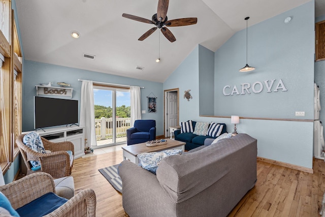 living area featuring light wood-style floors, visible vents, ceiling fan, and high vaulted ceiling