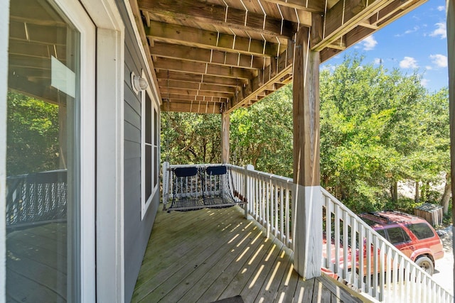 wooden terrace with a porch