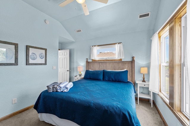 carpeted bedroom with vaulted ceiling, visible vents, and baseboards