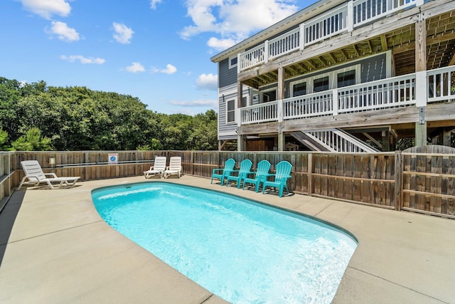 view of swimming pool with a fenced in pool, a patio area, and a fenced backyard